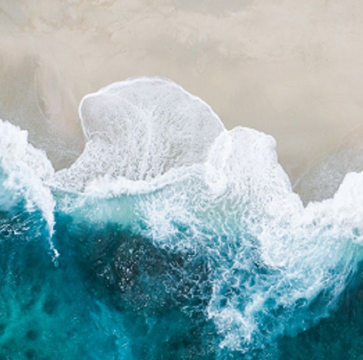 Seawater crashing on beach